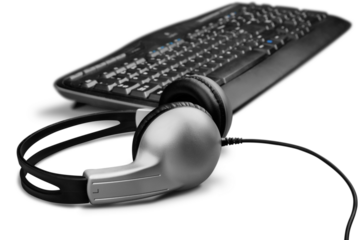 Modern black headphones and keyboard