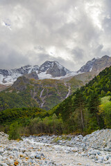 Mountain river in Ossetia, Tana glacier in the mountains. Caucasus mountains.