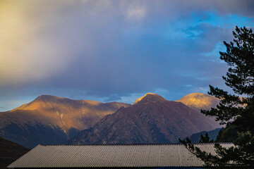 Sunset in the mountains. Rays fall on the mountains.