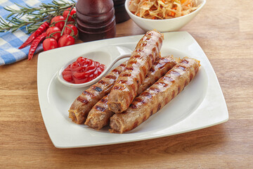 Grilled sausages with cabbage and sauce