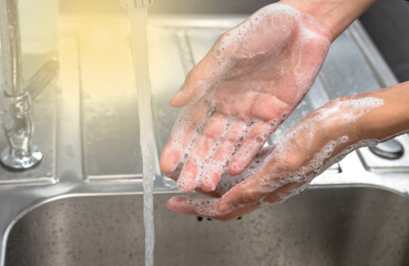 Close up hands washing with soap and rinsing water from water tab, Hands concept