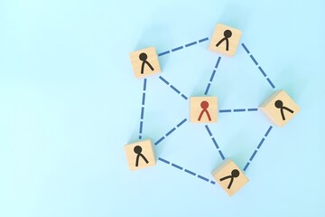 Social connections, teamwork and network in business concept. Interconnected wooden blocks flat lay...