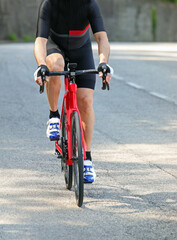 Fototapeta na wymiar cyclist with racing bike pedal fast on the road