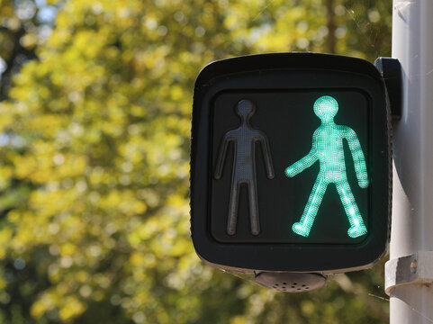 Bright Green Traffic Light Man In The City