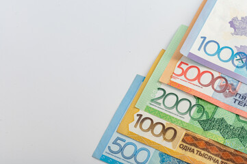 Kazakhstan money - tenge. 500, 1000, 2000, 5000, 10000 banknotes. Close up of tenge on white background.