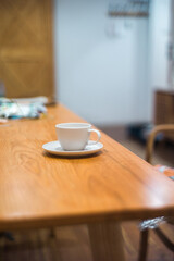 Fototapeta na wymiar cup of coffee on wooden table