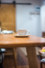 cup of coffee on wooden table