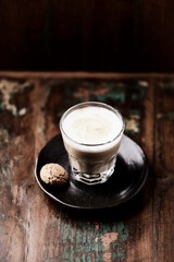 Coffee with milk on dark wooden background. Soft focus. Copy space.