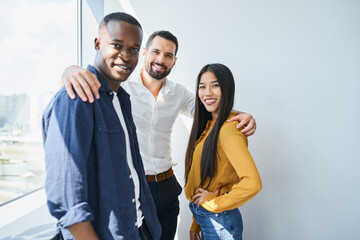 Portrait of successful office colleagues team standing together