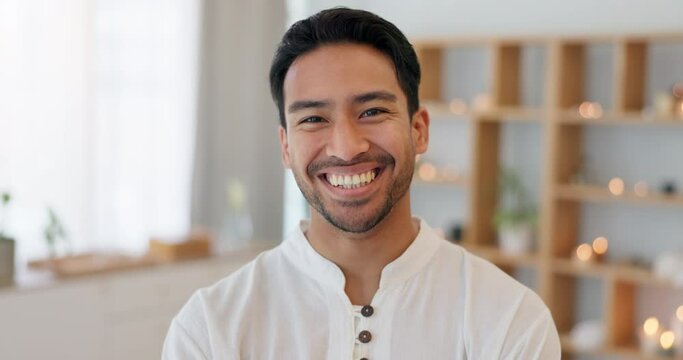 Man, portrait and massage therapist in spa, wellness center or zen clinic for holistic health and reiki energy healing. Smile, happy and laughing masseur in salon for relax chiropractic physiotherapy