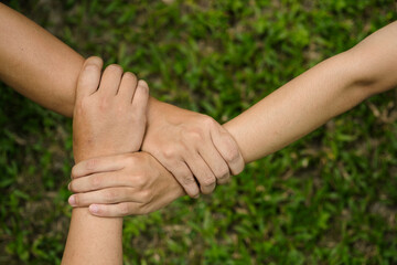 Hands holding tight promise mission teamwork green ecology system web banner template. Three...