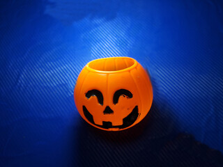 halloween pumpkin on blue,orange pumpkin head illustration on blue background