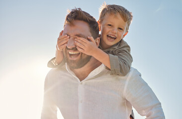 Dad, child and piggy back with covering eyes for game, playing and funny time in sunshine with love. Sun, sky and family with bonding, father and kid while laughing, comic and happy together outdoor