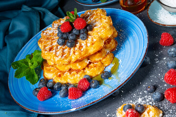 Simple sweet waffles with raspberries and blueberries