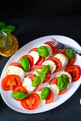 Tomato with mozzarella and basil