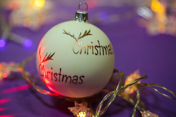 colorful christmas balls as background, colorful lights in background, christmas written