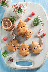 Sweet gingerbread cookies chain as Christmas ornaments.