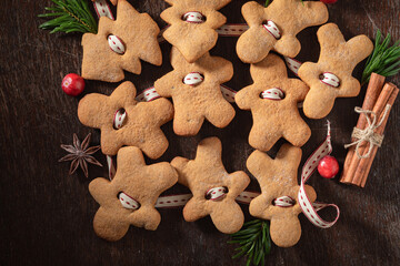 Homemade gingerbread cookies chain as Christmas ornaments.