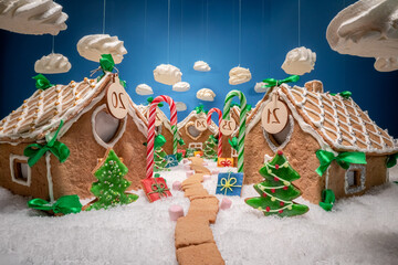 Homemade and unique Christmas gingerbread village with meringue clouds.