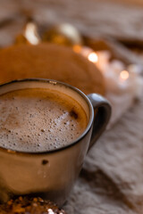 coffee in a designer mug and homemade honey cake on a wooden table in a New Year atmosphere. cozy christmas, cozy winter. High quality photo