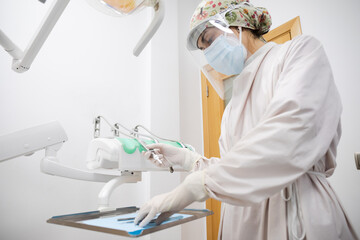 Pediatric dentist preparing to do a checkup. Point of view from the dentist chair. Child dental health