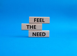 Fill the need symbol. Concept word Fill the need on wooden blocks. Beautiful blue background. Business and Fill the need concept. Copy space