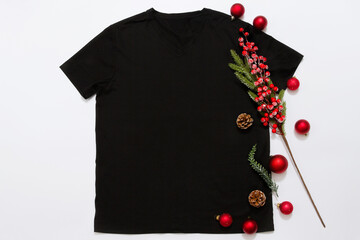 Close up black blank template t shirt with copy space and Christmas Holiday concept. Top view...