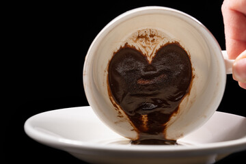Heart Shaped Coffee Grounds in a White Cup - obrazy, fototapety, plakaty