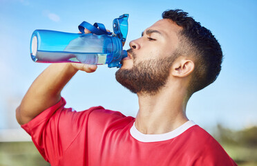 Man, soccer and hydration drinking water for sports, health and energy in fitness outdoors....