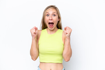 Young caucasian woman isolated on white background celebrating a victory in winner position