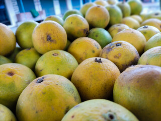 Yellow And Green Sweet Lemon In The Fruit Market