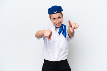 Fototapeta premium Airplane blonde stewardess woman isolated on white background points finger at you while smiling