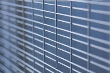 Close up textured background of a metal grating grid