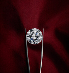 Round Diamond on Dark Red Fabric Background.