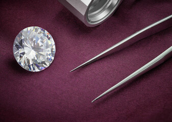 Big Round Diamond with Loupe and Tweezers on Plum Coloured Fabric Background. Luxury Diamond...