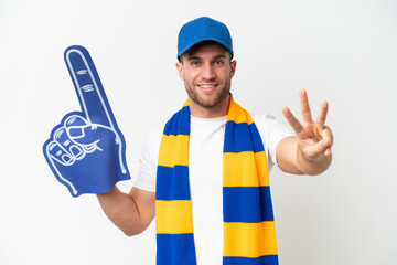 Young caucasian sports fan man isolated on white background happy and counting three with fingers