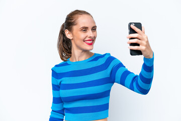 Young caucasian woman isolated on white background making a selfie