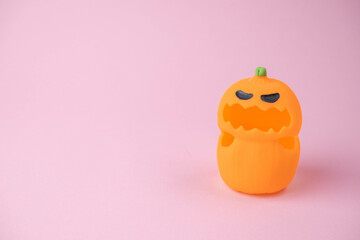 children's monsters for Halloween on pink and orange background , the concept of a children's holiday