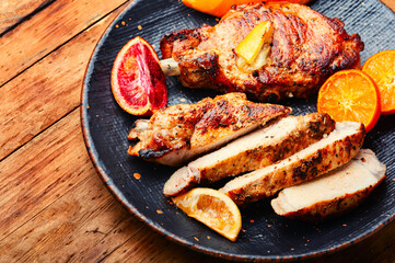 Meat roasted in orange sauce.