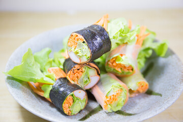Fresh vegetable salad rolls on the table.