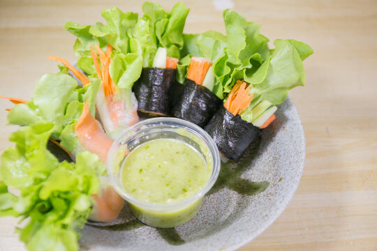 Fresh vegetable salad rolls with sea food saurce.