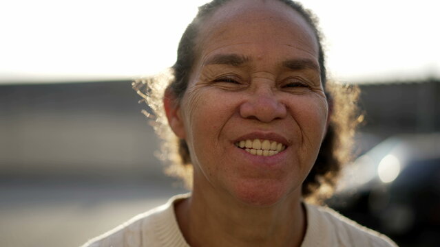 Happy Mature Hispanic Senior Woman Portrait Face Closeup Smiling At Camera. South American Latina Older Female Person