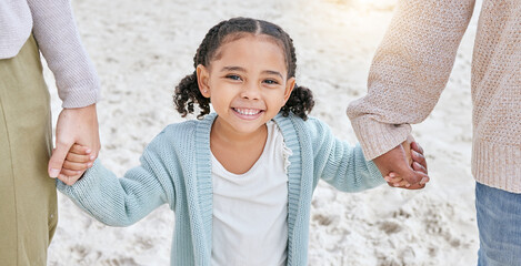 Happy, beach and a girl on holding hands with parents on a walk on the sea sand on a summer holiday. Family, support and love, happiness in fun quality time with young child walking on ocean vacation