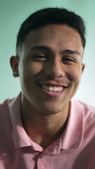 Obraz premium One confident latin hispanic person smiling at camera in vertical video