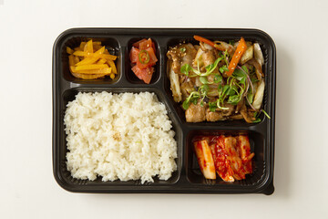 Various side dishes and samgyeopsal lunch box