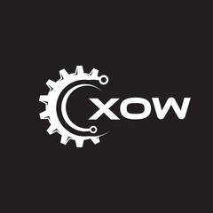 XOW letter technology logo design on black background. XOW creative initials letter IT logo concept. XOW setting shape design.

