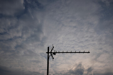 antenna on a cloudy sky