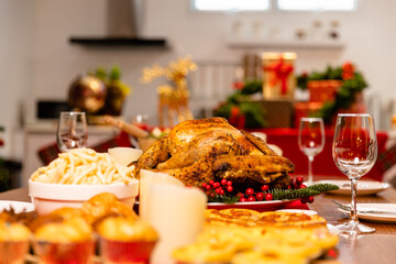Family have a celebration dinner in party with wine, champagne on Merry Christmas Eve Xmas on holiday at home. Roasted Thanksgiving Turkey with Side Dishes.Thanksgiving Celebration .