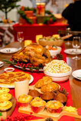 Family have a celebration dinner in party with wine, champagne on Merry Christmas Eve Xmas on holiday at home. Roasted Thanksgiving Turkey with Side Dishes.Thanksgiving Celebration .