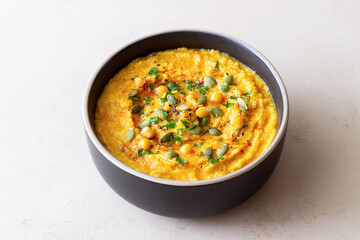 Pumpkin hummus with seeds and greens. Healthy eating. Vegetarian food.
